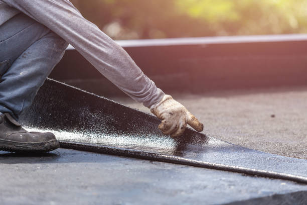 Professional Basement Waterproofing technician working in Farley, IA